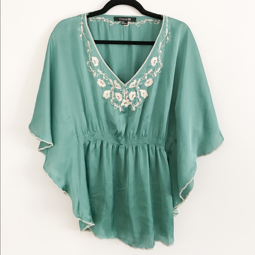 teal top with floral details